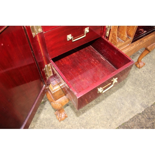 562 - A 1930s burr walnut fall front secretaire desk with fitted interior, including postal scales, barome... 