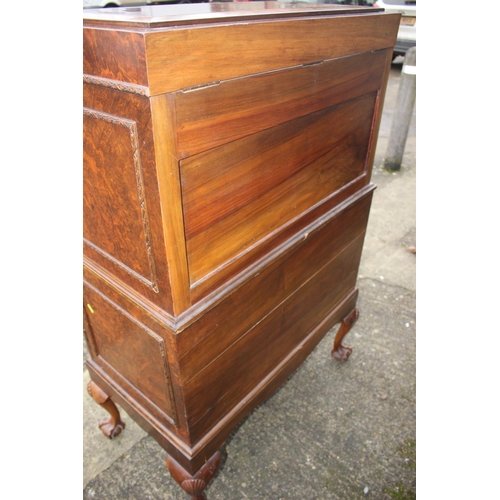 562 - A 1930s burr walnut fall front secretaire desk with fitted interior, including postal scales, barome... 