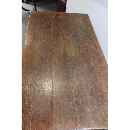 563 - An antique pitch pine refectory table, on chamfered 'X' frame supports, 54