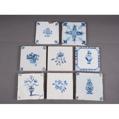 58 - An early 18th century Liverpool delft blue and white floral decorated tile, five similar tiles with ... 