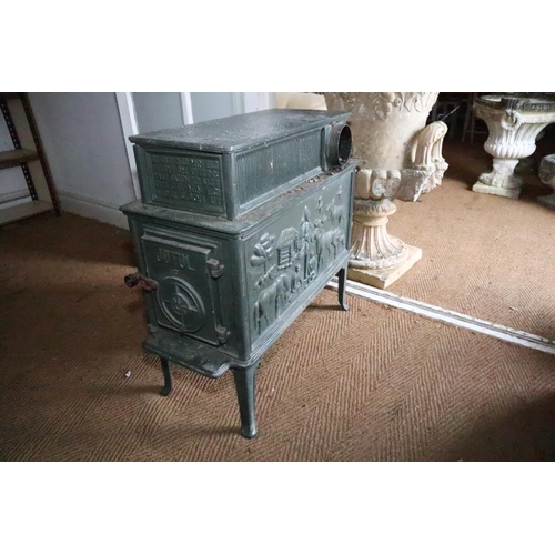 590 - A Jotul green enamelled wood burner stove with Scandinavian animal relief decoration, 14