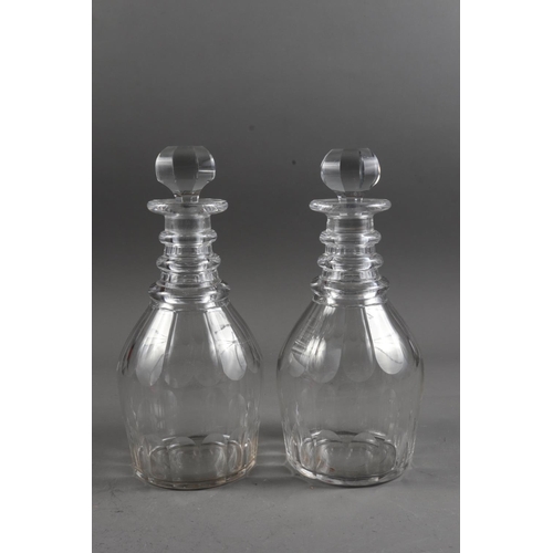 61 - A pair of Georgian triple ring neck decanters and stoppers, 10