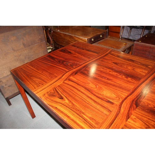 544 - A 1970s Danish rosewood extending dining table, by Henning Kjaernulf for Vejle & Stole, 35 1/2