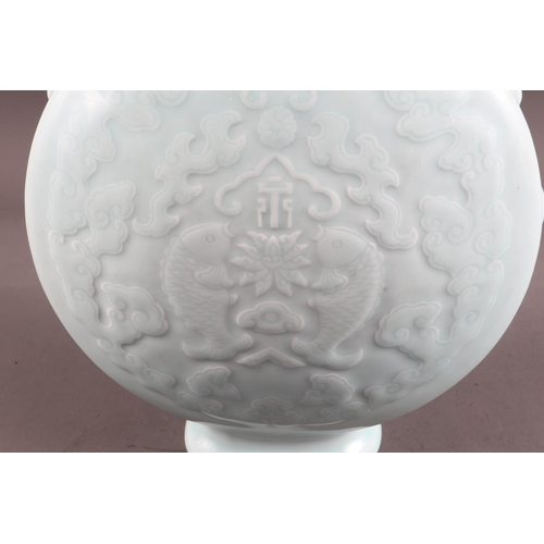 100 - A Chinese celadon glazed two-handled moon flask with pair of fish, character and cloud decoration, s... 