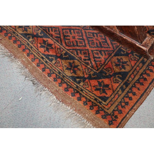 569 - An Afghan gold washed carpet with twelve medallions to centre panel, multi borders in traditional sh... 