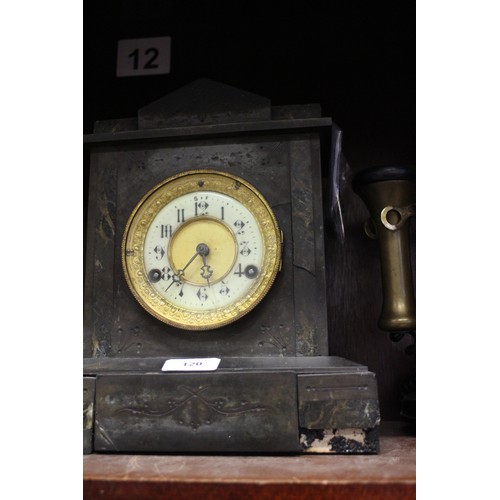 120 - A rotary candlestick black and brass mounted telephone and a slate mantel clock with enamelled dial ... 