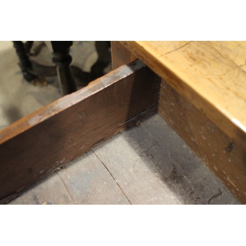 430 - An early 18th century yew side table, fitted one drawer with brass shaped drop handle, on bobbin tur... 