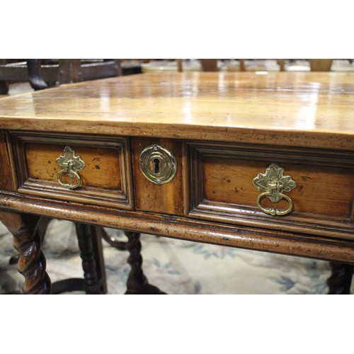 430 - An early 18th century yew side table, fitted one drawer with brass shaped drop handle, on bobbin tur... 