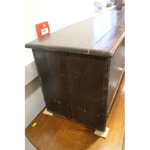 476 - A 17th century oak boarded coffer, on panel end supports, 51