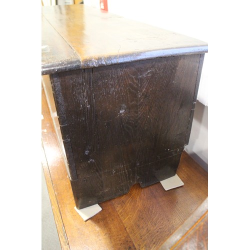 476 - A 17th century oak boarded coffer, on panel end supports, 51