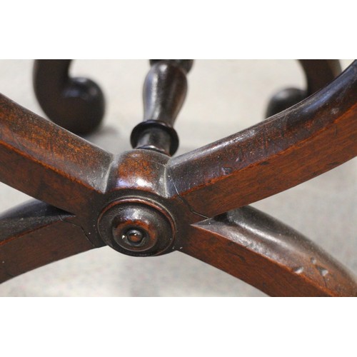 484 - A 19th century mahogany 'X' frame stool, 15