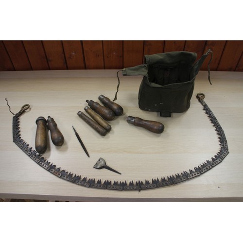 202 - A Commando chain saw, a quantity of canvas bags, pouches, hats and other items, contained in a tin t... 