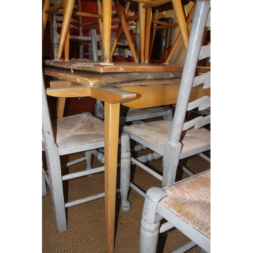 536 - A vintage Ercol extending elm top dining table, on splay supports, 8