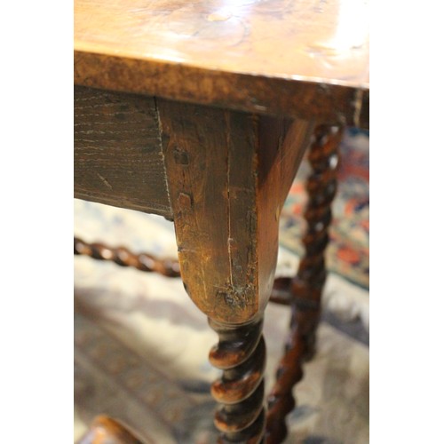 430 - An early 18th century yew side table, fitted one drawer with brass shaped drop handle, on bobbin tur... 