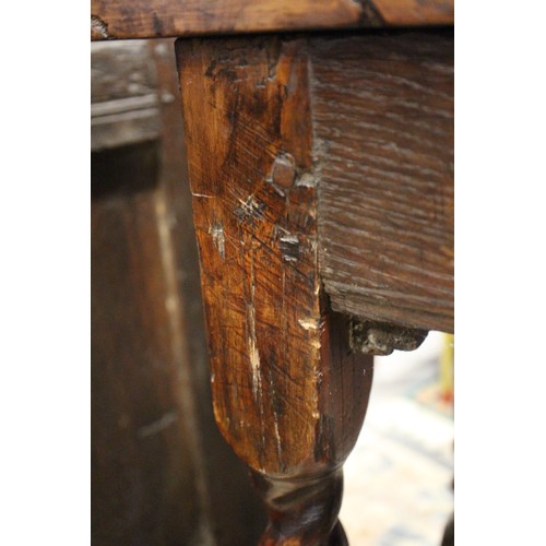 430 - An early 18th century yew side table, fitted one drawer with brass shaped drop handle, on bobbin tur... 