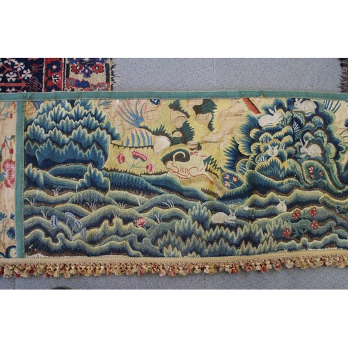 252 - A circa 1700 crewel work fragmentary landscape panel with additional end panels and later fringe, 19... 