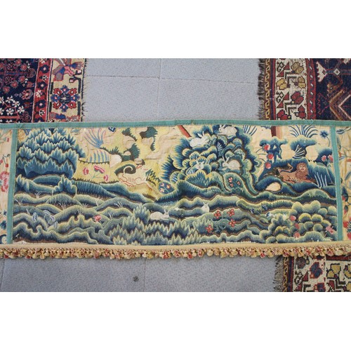 252 - A circa 1700 crewel work fragmentary landscape panel with additional end panels and later fringe, 19... 