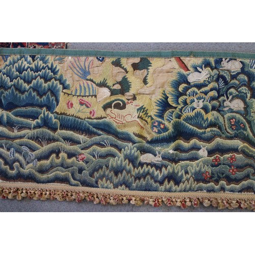 252 - A circa 1700 crewel work fragmentary landscape panel with additional end panels and later fringe, 19... 