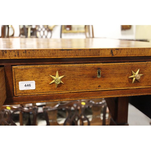 446 - A Regency rosewood and mahogany banded sofa table, fitted two drawers with brass star handles, on sp... 