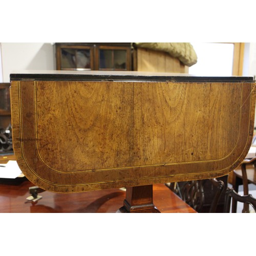 446 - A Regency rosewood and mahogany banded sofa table, fitted two drawers with brass star handles, on sp... 