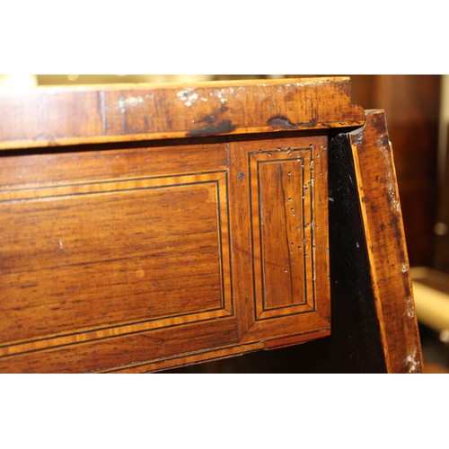 446 - A Regency rosewood and mahogany banded sofa table, fitted two drawers with brass star handles, on sp... 