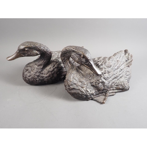 104 - A pair of patinated model geese, 12