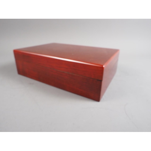 124 - A lacquered mahogany humidor with fitted interior, 11