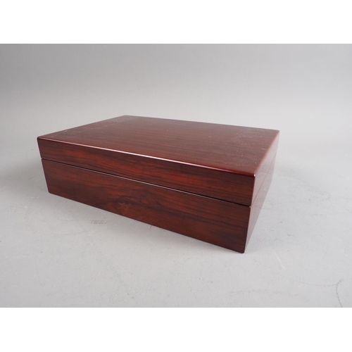 125 - A lacquered rosewood humidor with fitted interior, 11