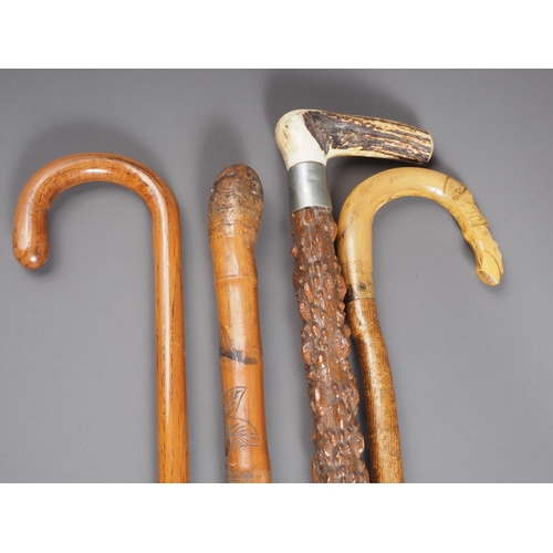 147 - An early 20th century antler handle walking stick, 36