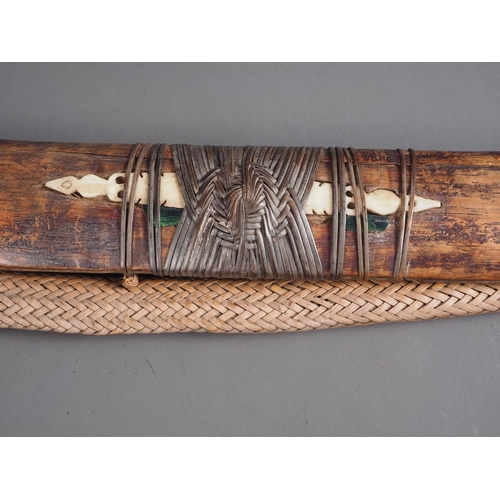 150 - An Indonesian Dayak Mandau sword with paktong? pellets inlaid on the blade and carved bone handle/po... 