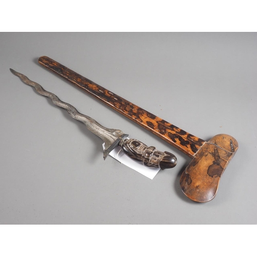 151 - An Indonesian Kris dagger with marbled pamor blade, carved  horn erotic hilt and hardwood scabbard, ... 