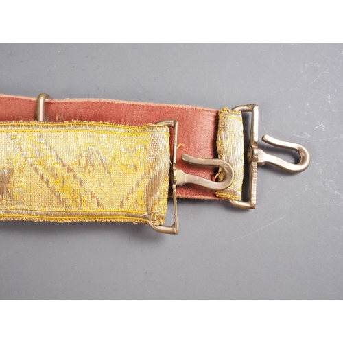 172 - An early 20th century gilt embroidered Spanish Parade belt with brass and red enamelled badge, 40 1/... 