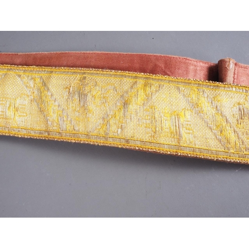 172 - An early 20th century gilt embroidered Spanish Parade belt with brass and red enamelled badge, 40 1/... 