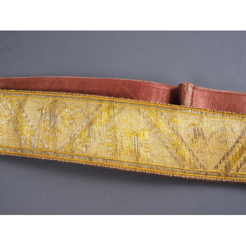 172 - An early 20th century gilt embroidered Spanish Parade belt with brass and red enamelled badge, 40 1/... 