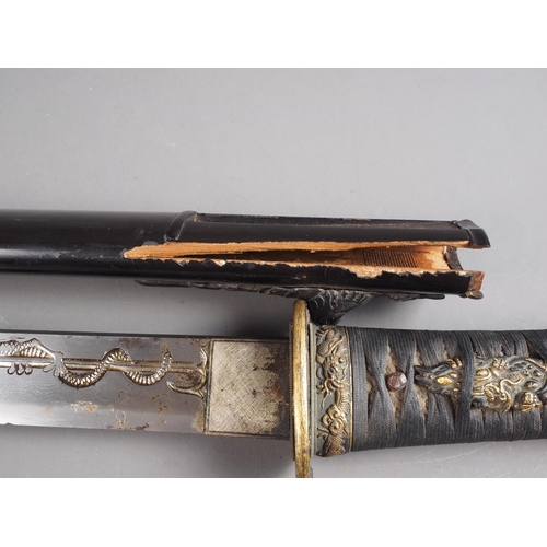 182 - A 19th century Japanese Tanto short sword, blade with engraved dragon on one side and a cherry bloss... 