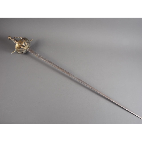 184 - A rapier with engraved blade, pierced brass guard and classical themed handle, 39 1/2” long, and an ... 