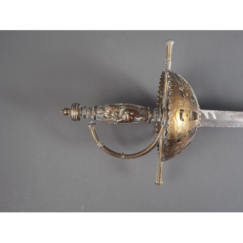 184 - A rapier with engraved blade, pierced brass guard and classical themed handle, 39 1/2” long, and an ... 