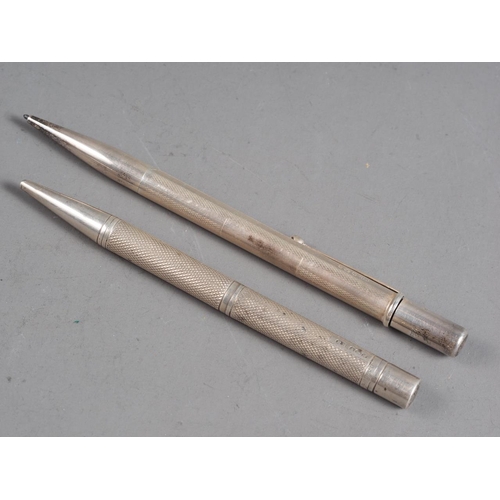 258 - Two engine turned silver propelling pencils