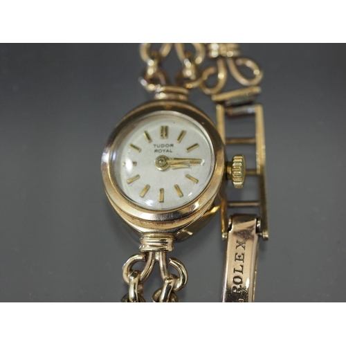 298 - A ladies Tudor Royal 9ct gold cased wristwatch with white enamel dial and baton numerals, on 9ct gol... 