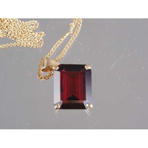 300 - A 9ct gold and garnet pendant, on 9ct gold fine link chain 4.1g