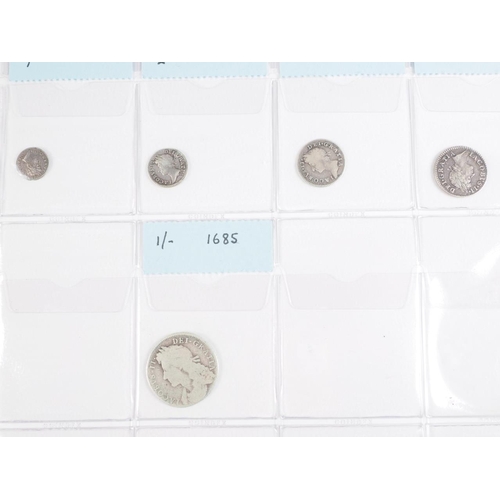 359 - Two albums of British silver and other coinage from King Charles II to the present day