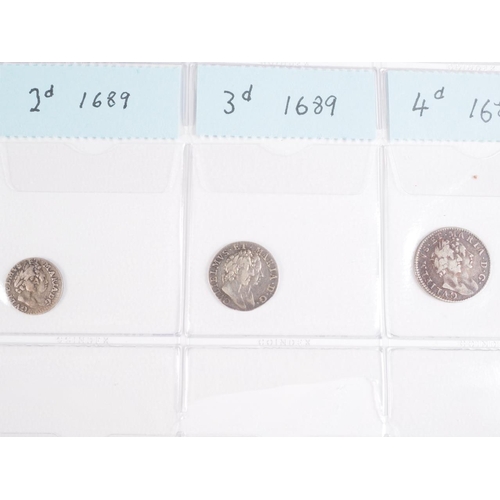 359 - Two albums of British silver and other coinage from King Charles II to the present day