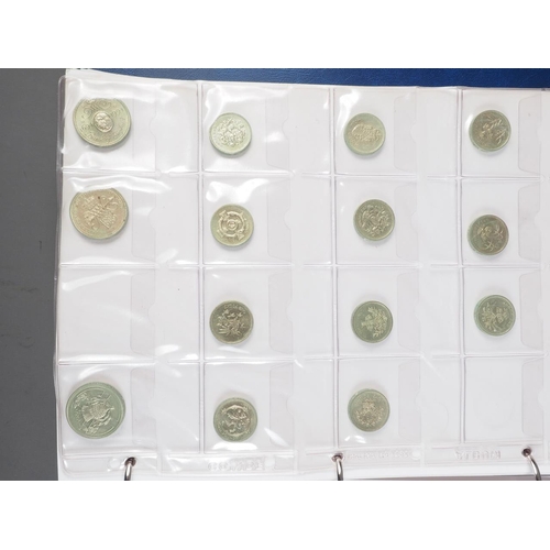 359 - Two albums of British silver and other coinage from King Charles II to the present day