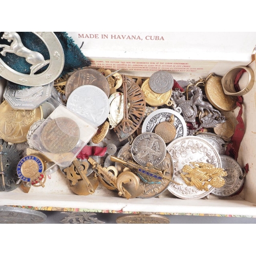 382 - A quantity of mostly military British badges, commemorative medallions and other items, including a ... 