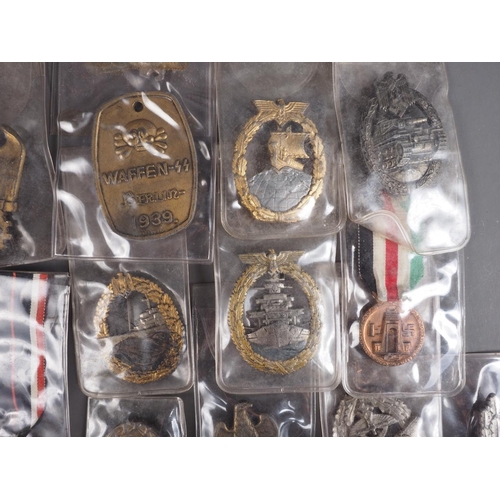 387 - A quantity of Nazi medals and badges, including a Kriegsmarine Destroyer Navy badge, a War Merit Cro... 