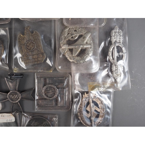 387 - A quantity of Nazi medals and badges, including a Kriegsmarine Destroyer Navy badge, a War Merit Cro... 