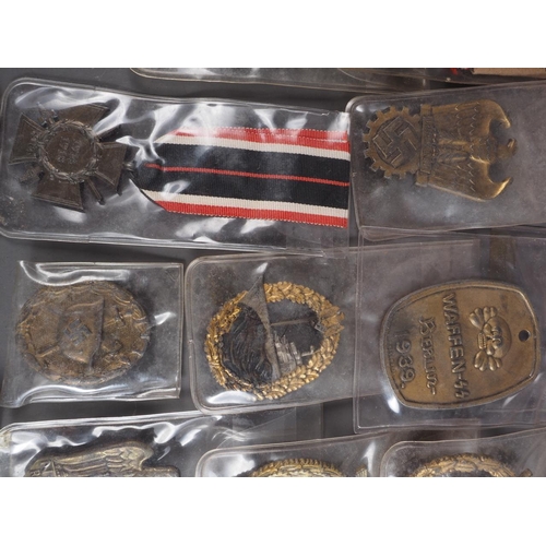 387 - A quantity of Nazi medals and badges, including a Kriegsmarine Destroyer Navy badge, a War Merit Cro... 