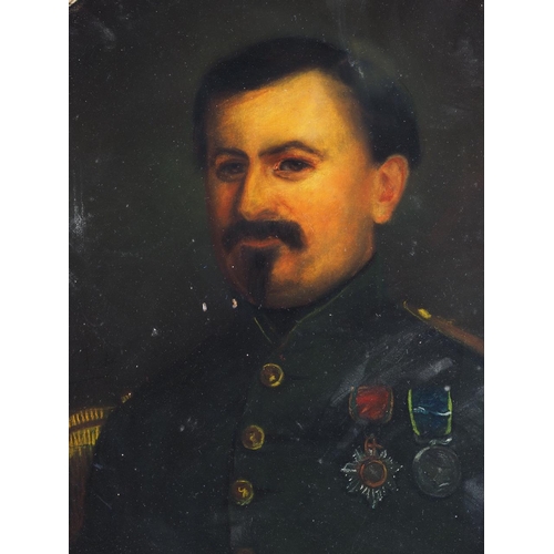 475 - A 19th century oil on canvas oval portrait of a Continental military officer, 29