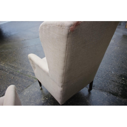 482 - Pair of wing arm chairs, upholstered in a sack cloth, on square taper castored supports