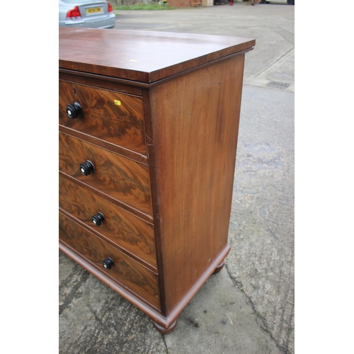 483 - A Victorian flame figured mahogany chest of four long graduated drawers with turned ebony and knobs ... 